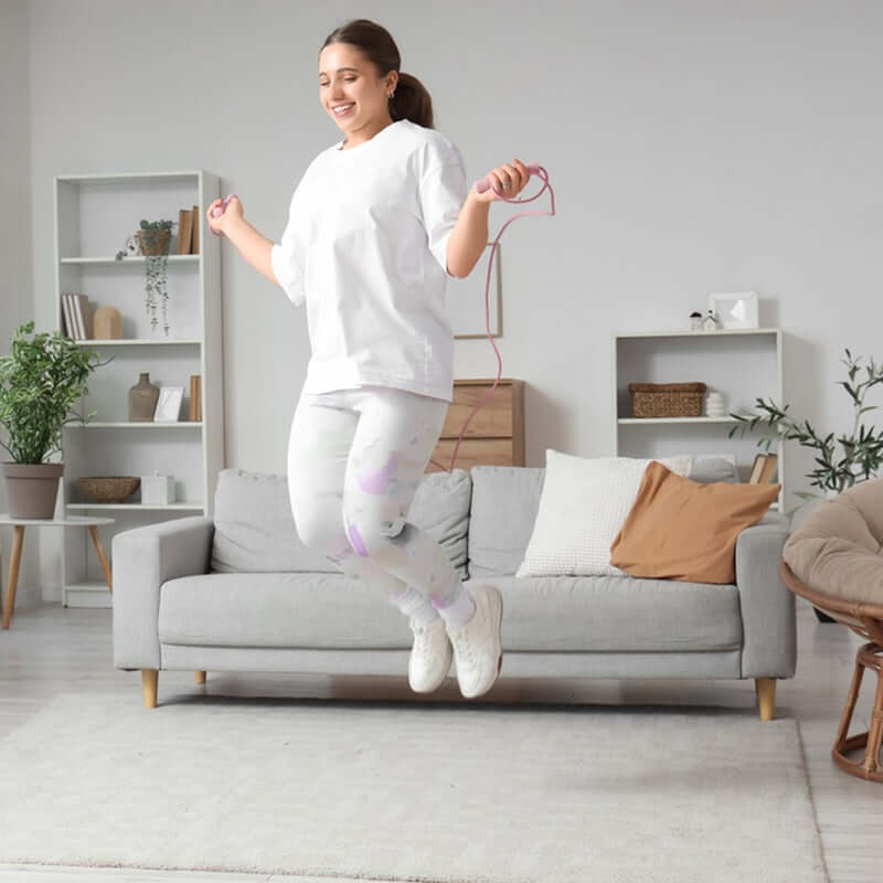 Person Using an Intelligent Counting Jump Rope During a Workout
